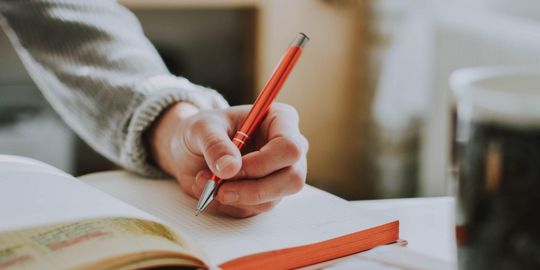 student taking notes